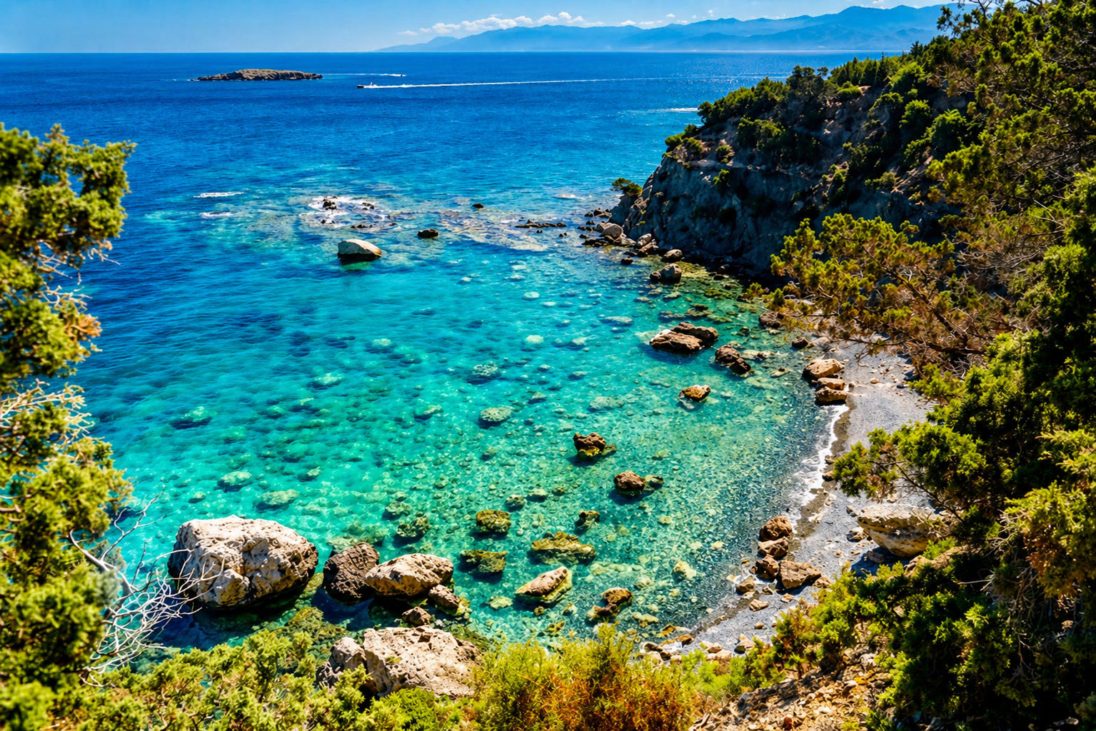 Akamas coastline near Latchi Cyprus with clear turquoise water and rocky reef formations, gateway to remote diving sites
