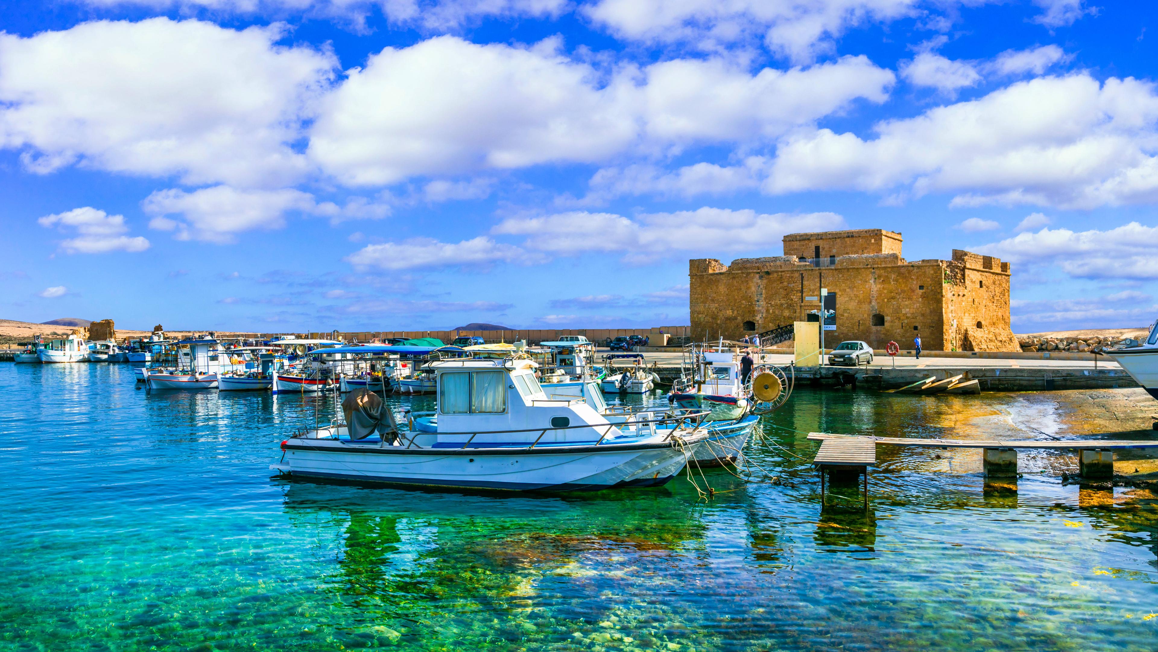 Paphos harbour Cyprus with clear Mediterranean water and coastal fort, gateway to reef and cave diving sites