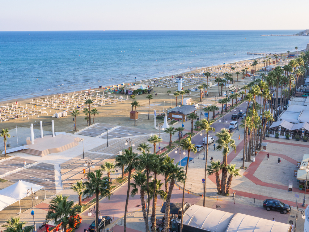 Finikoudes beach and Larnaca coastline in Cyprus with palm-lined promenade and Mediterranean sea